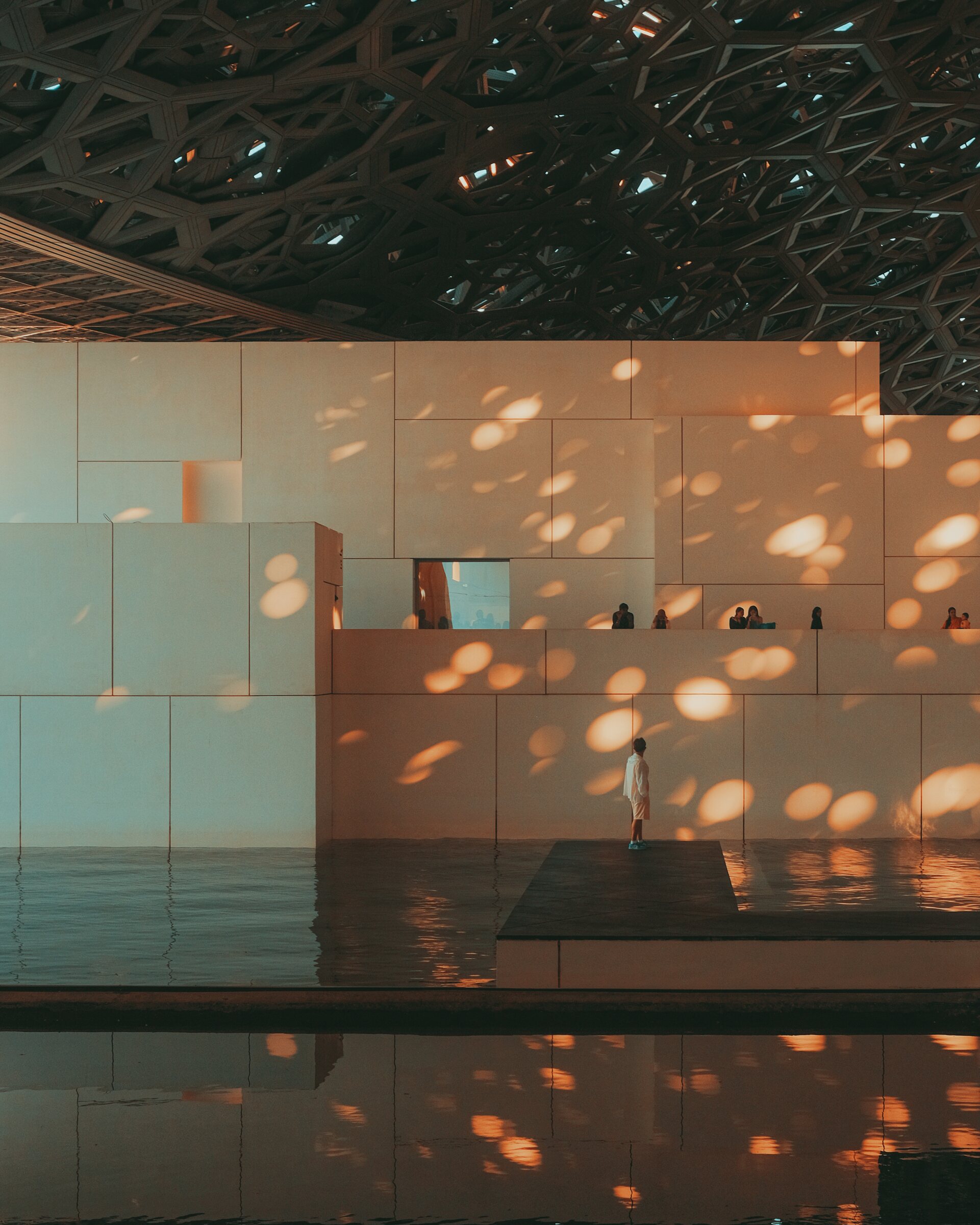 Dappled light beneath the Louvre Abu Dhabi dome