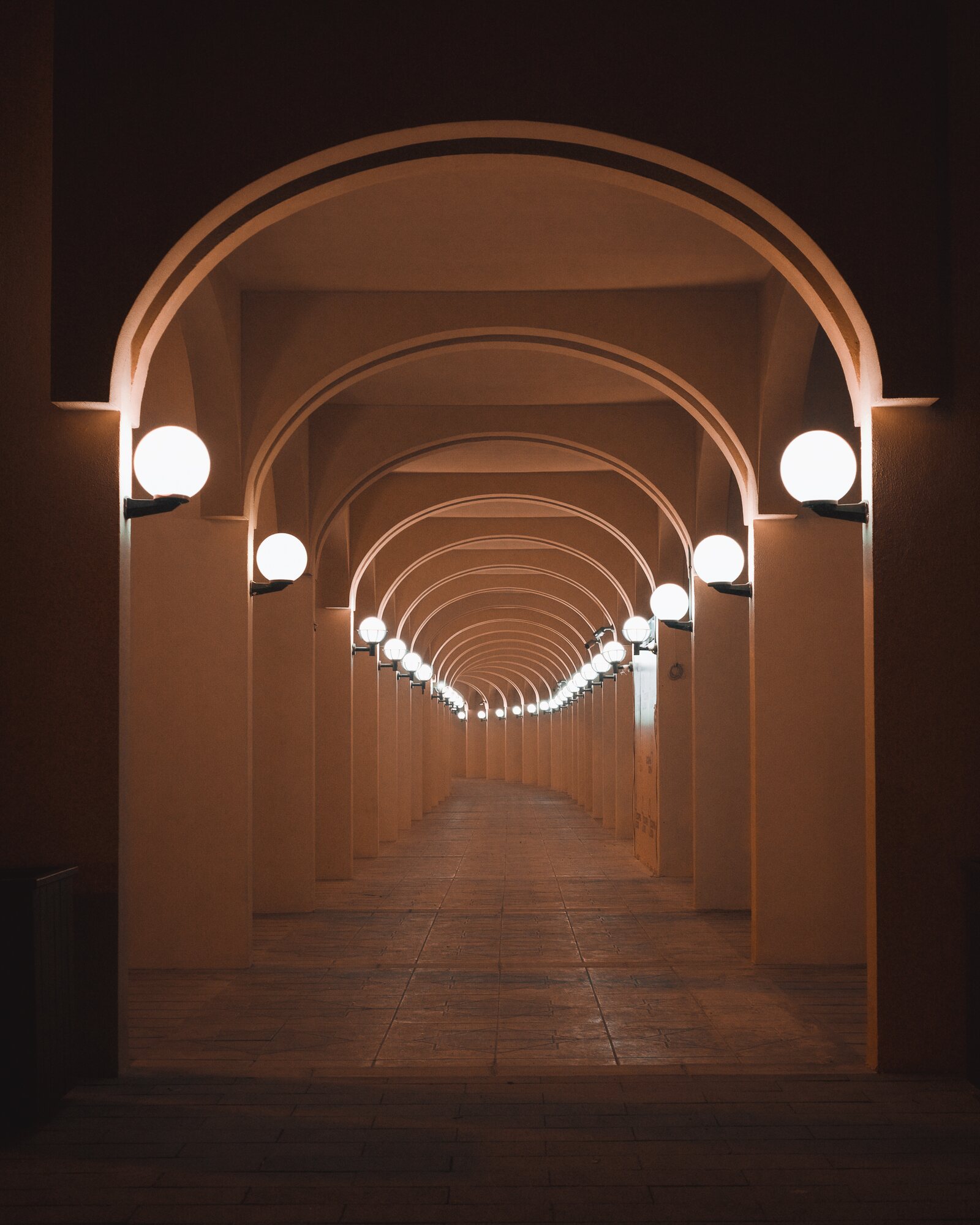 Quiet arched corridor at Souq Al Mina